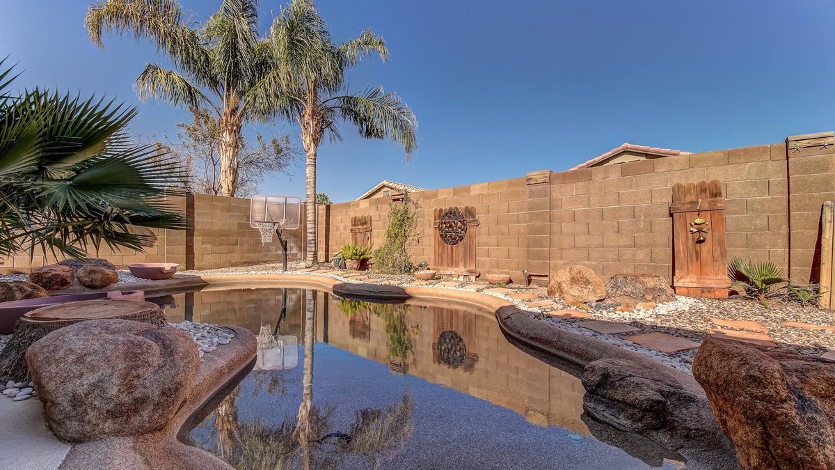 San Tan Valley House | Backyard oasis with private solar heated pool, hot tub and tons of amenities!