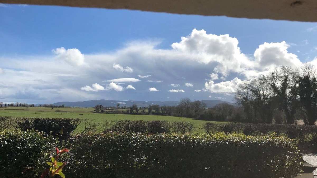 County Cork House | Ballygown Cottage with views across open countryside out to the mountains