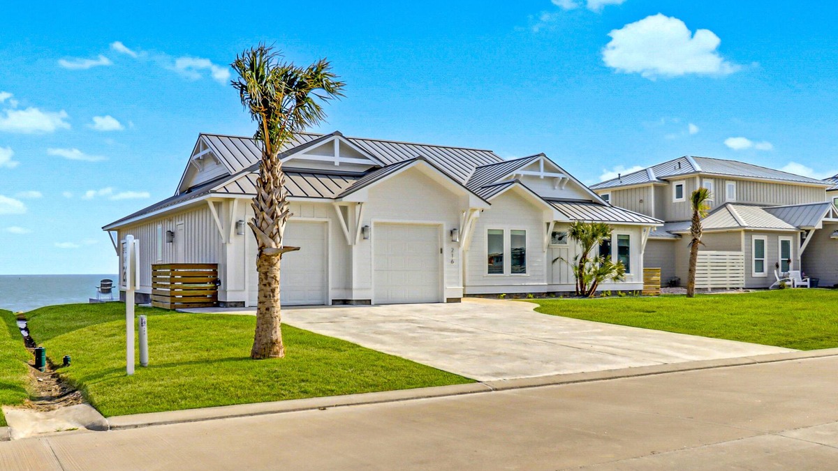 Rockport House | Bayfront water-view home with outdoor pool, lovely patio, hammock, fishing dock