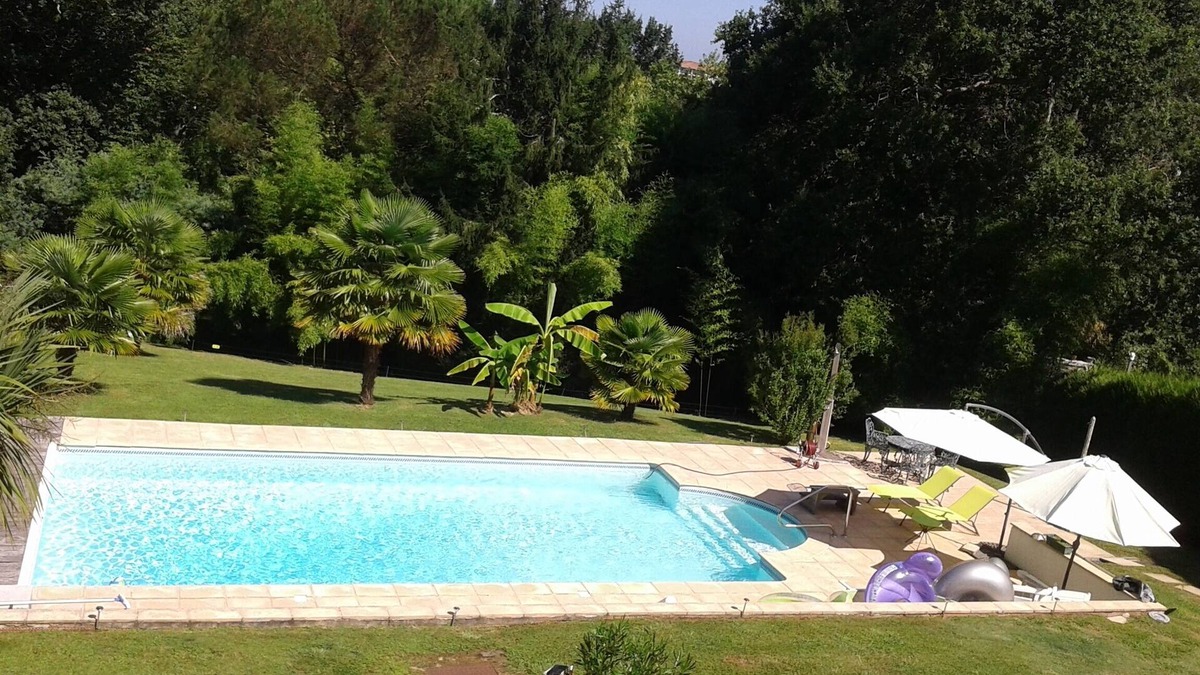 Bayonne House | Bayonne calm and relaxation by the heated swimming pool in lush greenery