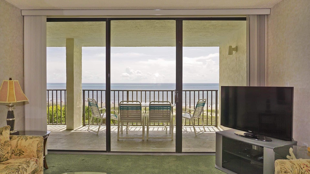 Port Canaveral Condo | BEACH FRONT TOP FLOOR w/Private Balcony - Master Bedroom & Living Room on Ocean