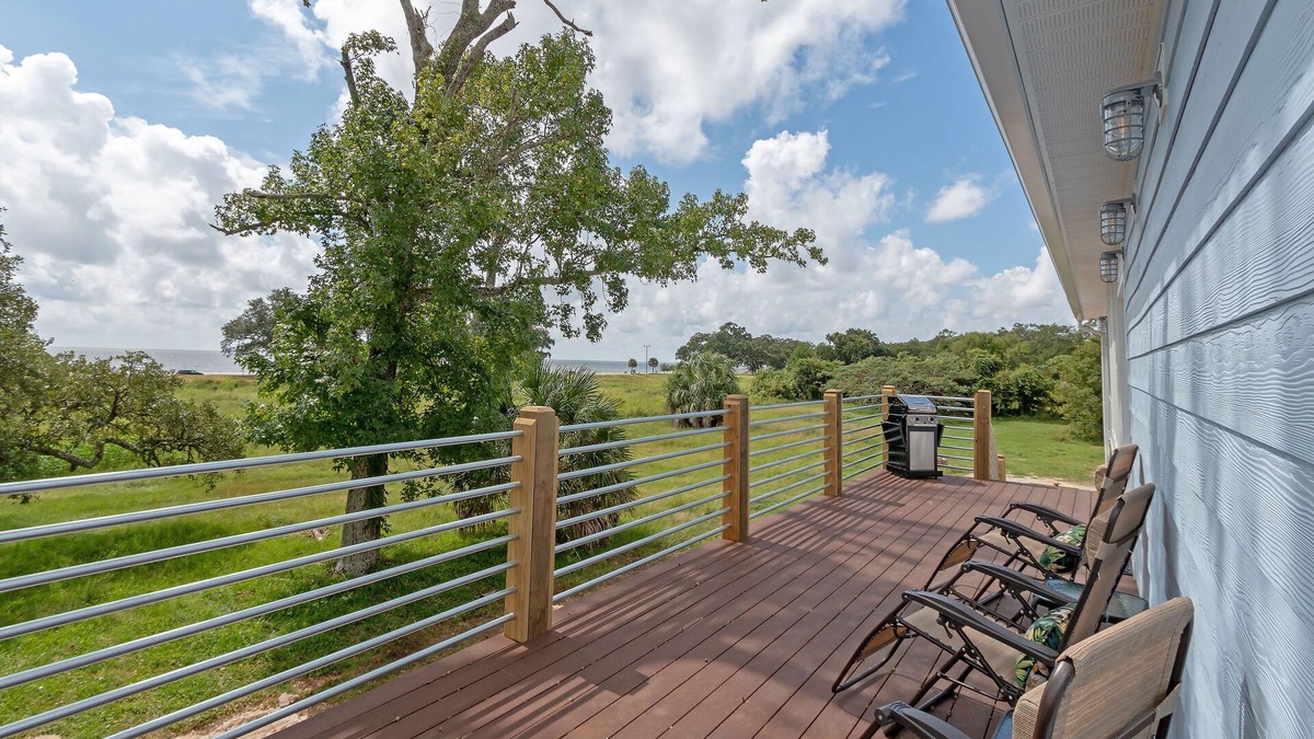 Mississippi City House | Beach house with gorgeous views, private green space, and steps to the beach.