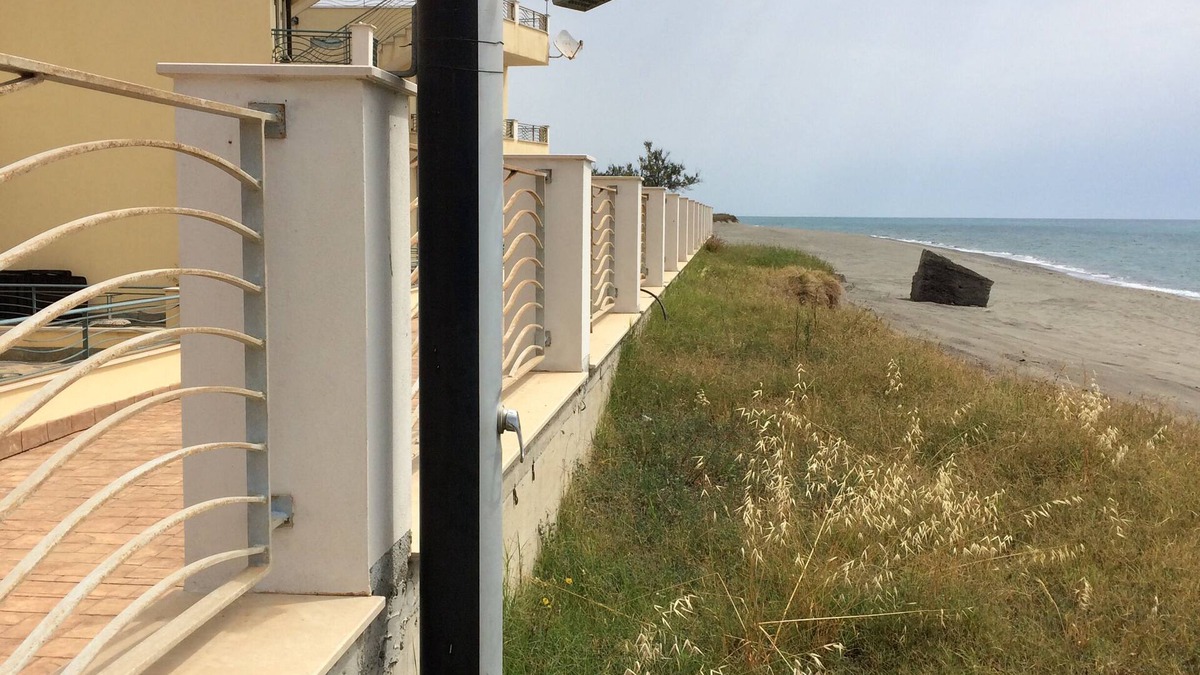 Brancaleone Apartment | Beachfront apartment in prime position with rooftop terrace, balcony and patio.