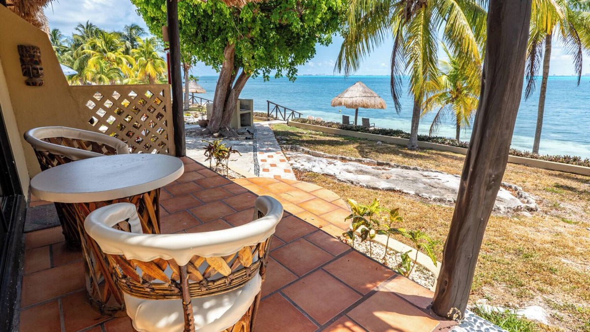 Isla Mujeres Cottage | Beachfront palapa cottage with heated pool , sunsets and tropical gardens