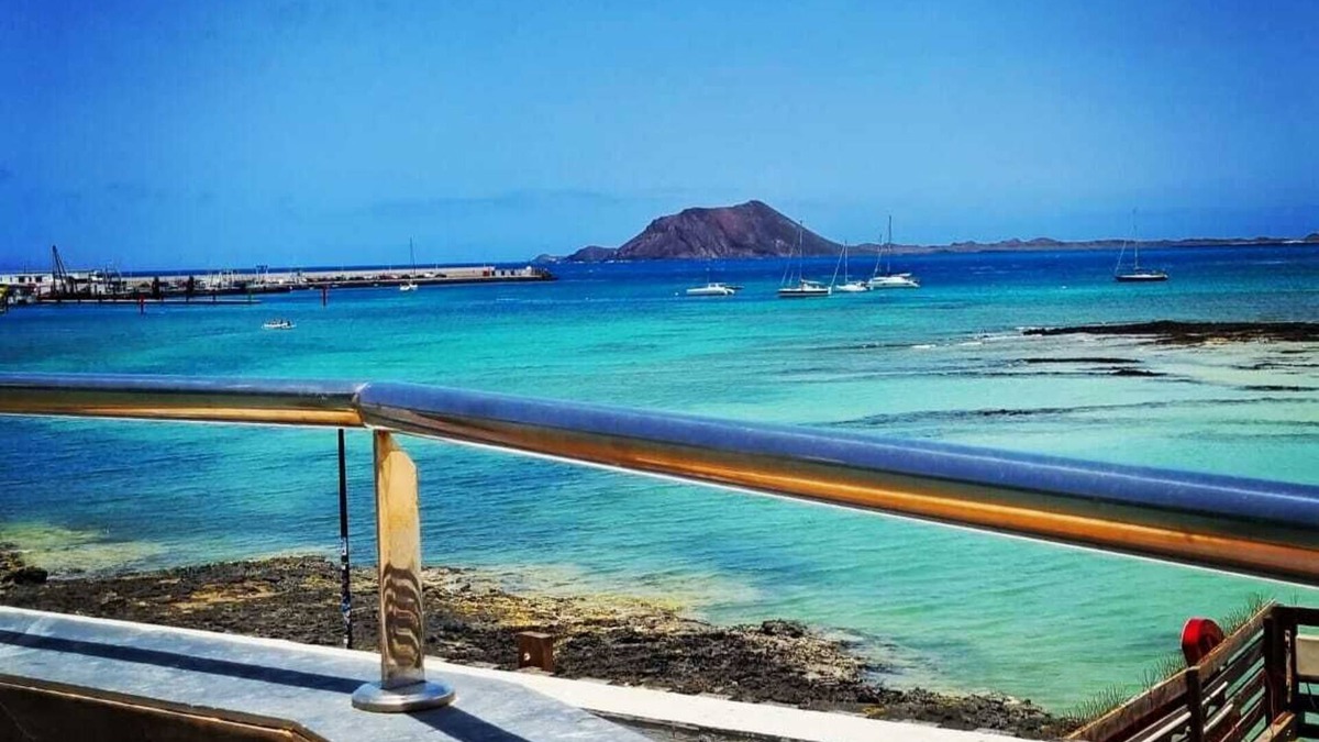 Corralejo Apartment | Beautiful Beachfront APTMTO at waters edge with stunning Ocean and Harbour views