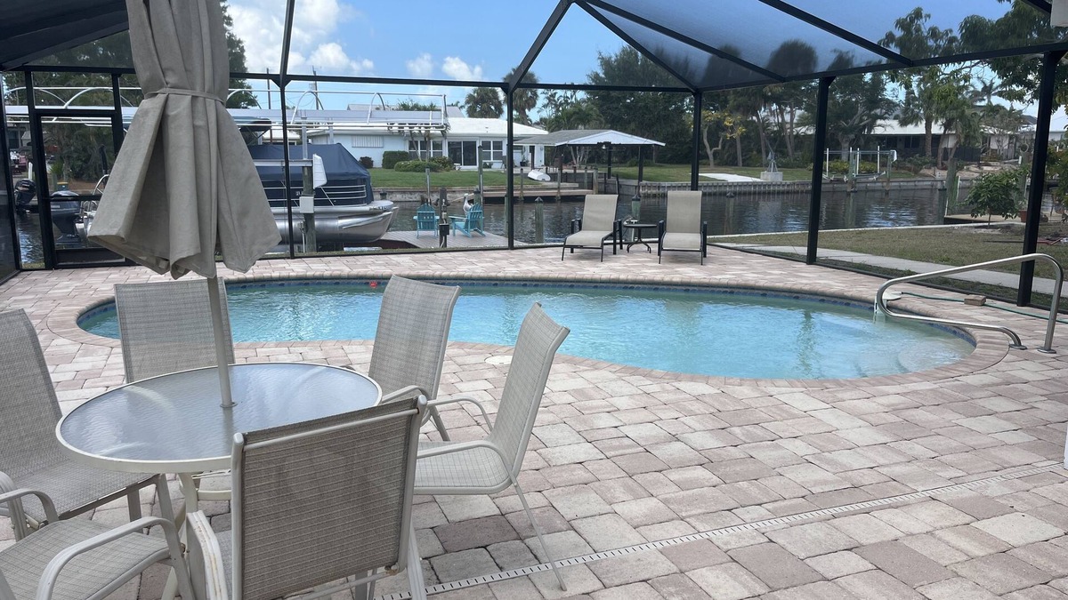 Bokeelia Apartment | Beautiful pool home on canal with 45-foot boat dock. 10 minutes to Gulf by boat.