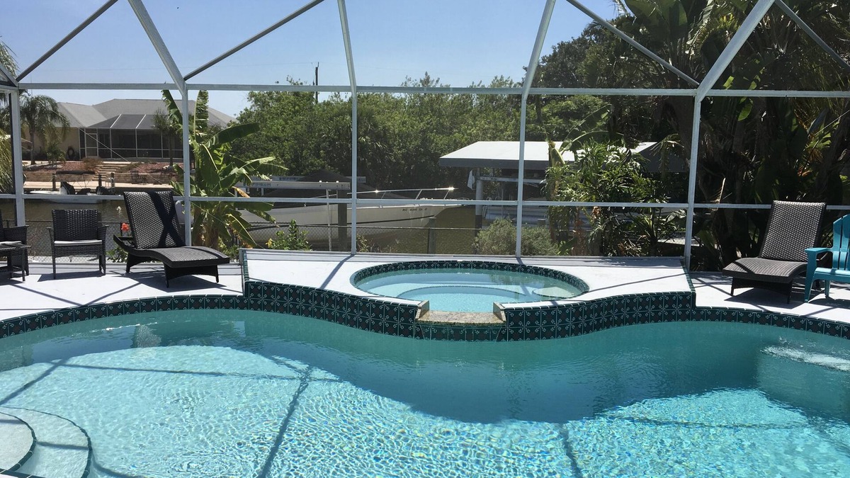 South Gulf Cove House | Beautiful relaxing waterfront home with pool, spa and boat dock.