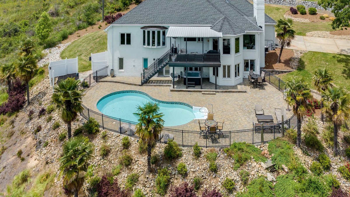 Rock Hill House | Beautiful Waterfront Home with abundant outdoor seating, pool, hot tub, grill