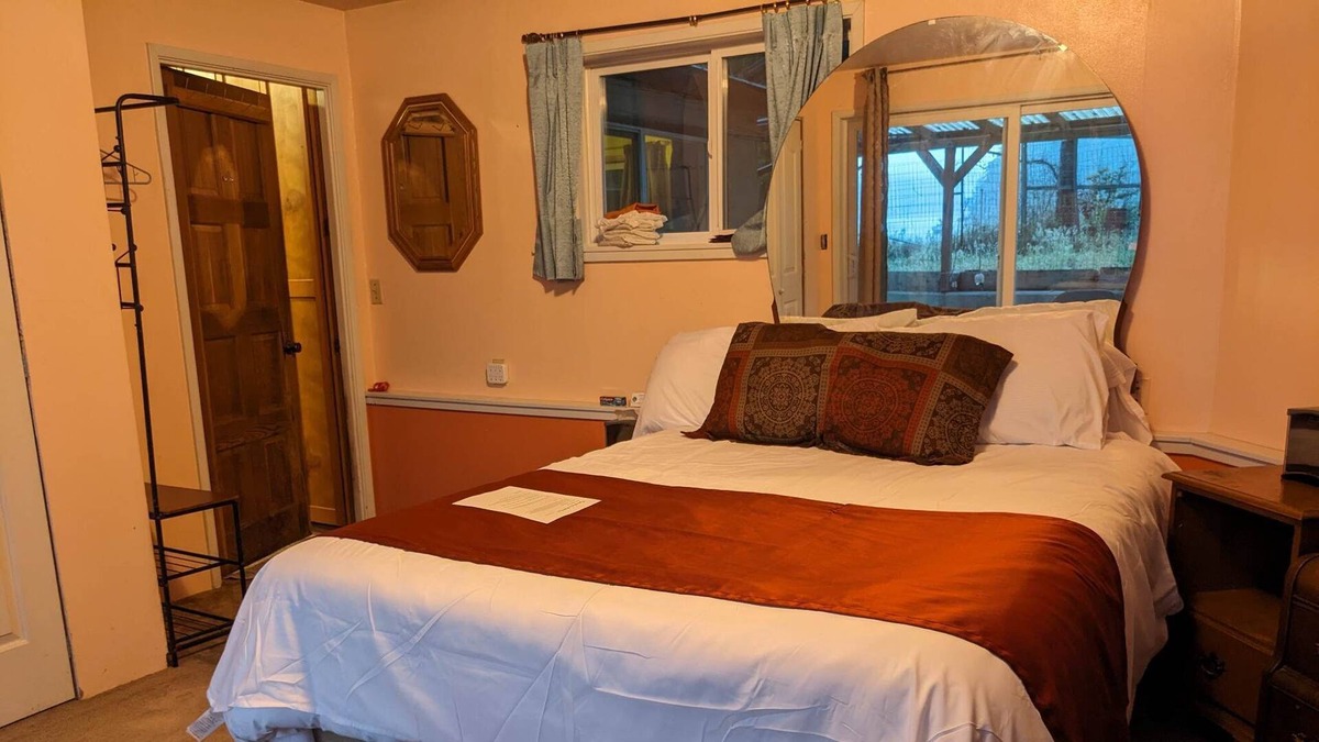 Marrowstone Cabin | Bed and a twin bed, bedroom individual, entrance and exit to private beach