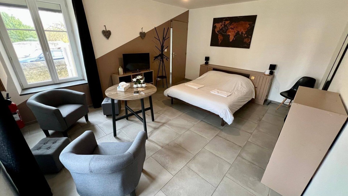 Lussac-les-Chateaux Apartment | Bedroom with private bathroom