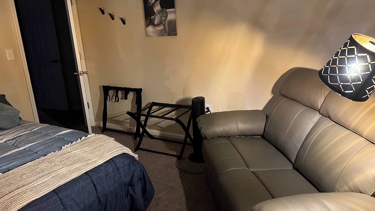 Gainesville Condo | Bedroom within 3BR condo - dog friendly