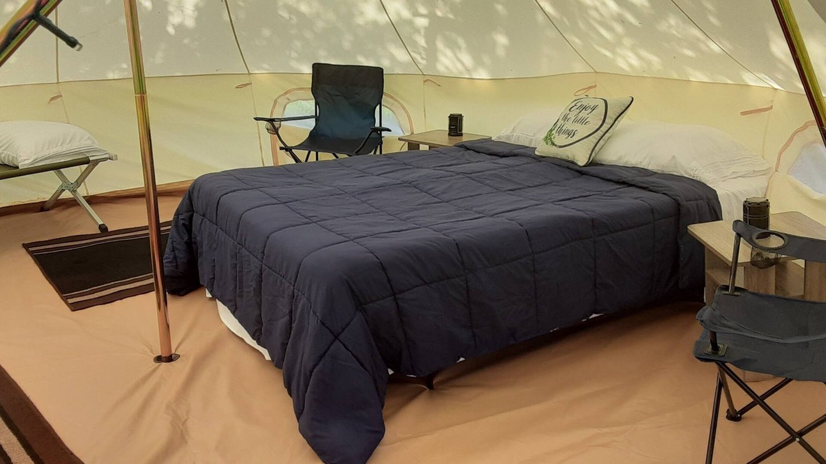 Spring Branch RV Rental | Bent Oak Glamping Tent Queen Bed, 2 Cots, Electric and AC