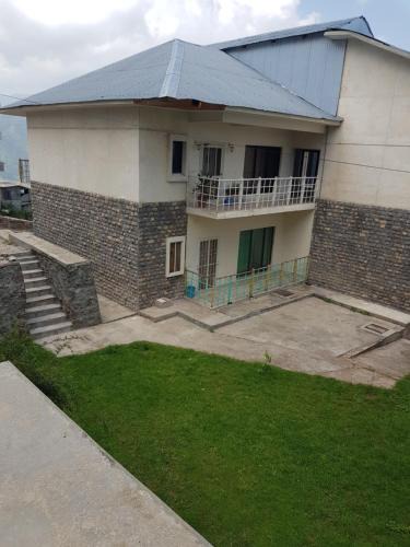 Dhirkot Apartment | Bhurban 2bed townhouse with a lawn
