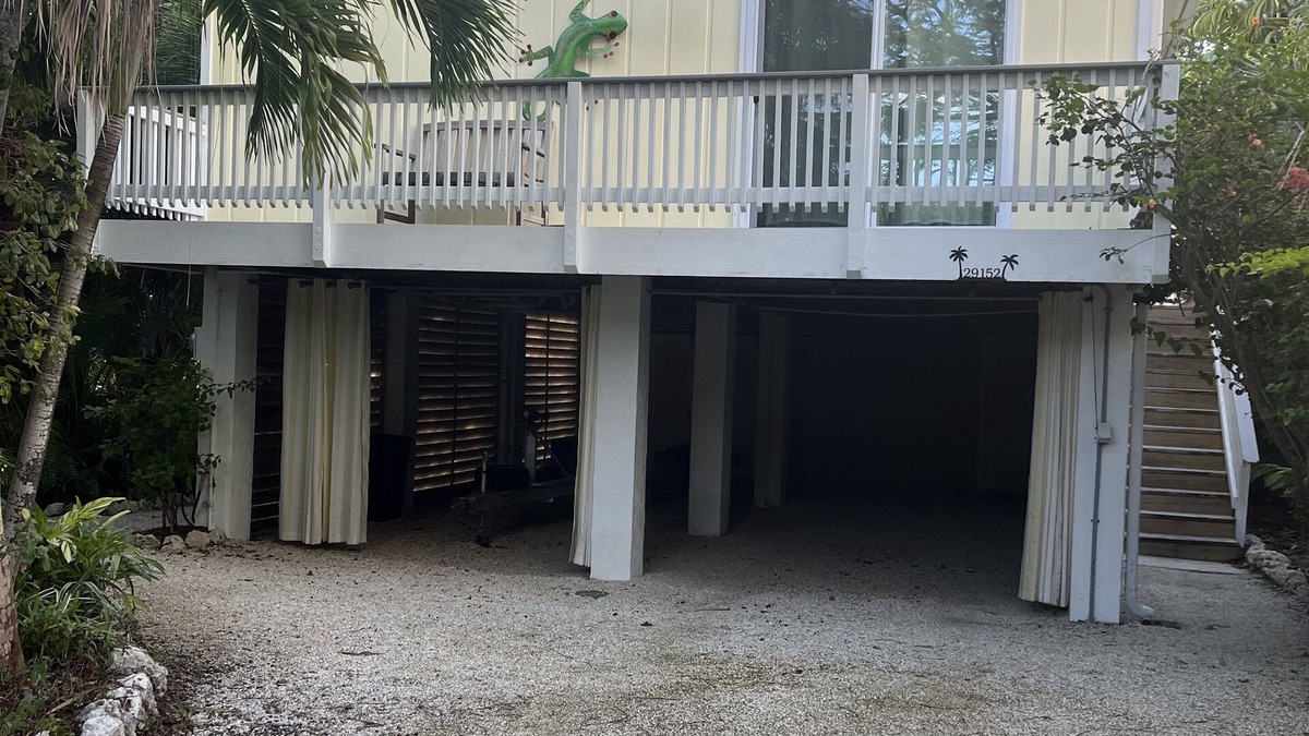 Eden Pines House | Big Pine Key Paradise Canal front fenced yard.