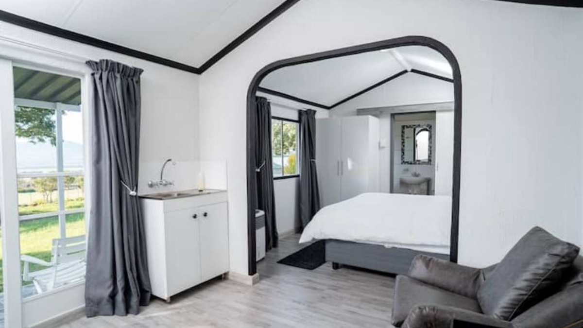 Hartbeespoort Ski Chalet | Black and White House