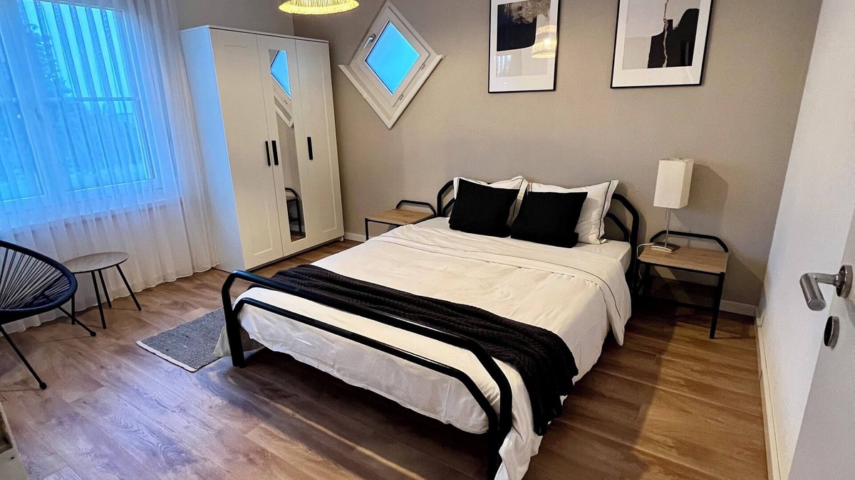 Oberuzwil Condo | Black & White Apartment