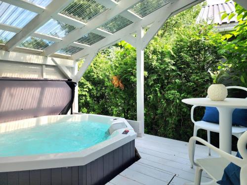 Quartier 5-4 House | Boho Chic Tiny House with Hot Tub