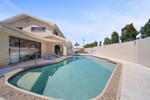 Woorim House | Bribie Beach House with Pool - Walk to Surf & Shops