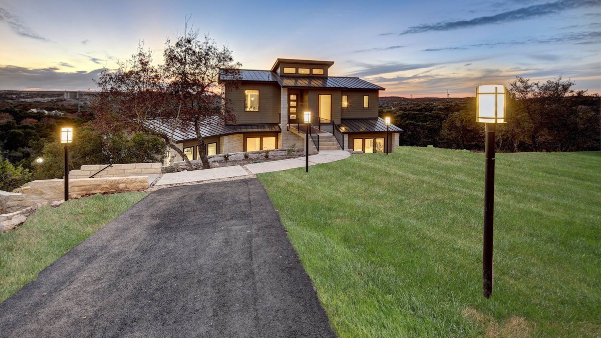 Lost Creek House | Bridge to Happiness: Cross the entry bridge into a gorgeous 4 bedrooms residence
