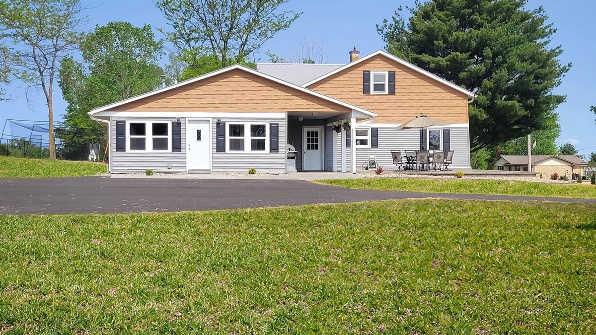 Dyersville House | Bring the whole family to this great home with an acre of room for fun.