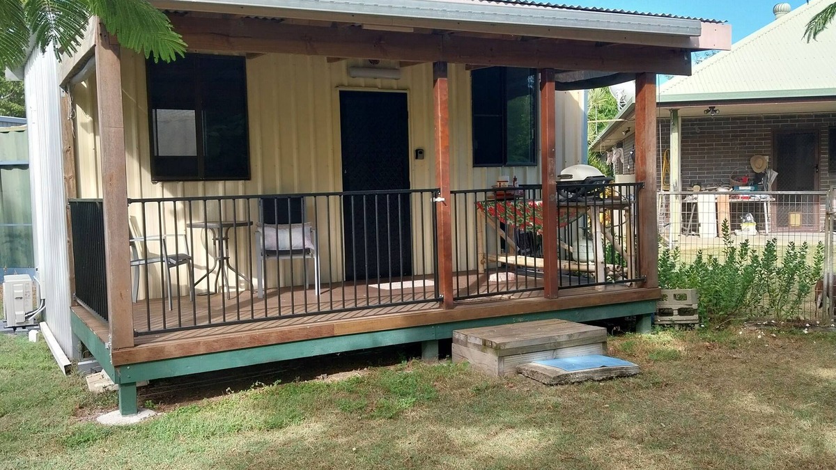 Coonarr Cabin | Bundaberg PETS A/C Small Rustic Cabin 1 bed kitchenette fridge bathroom BBQ deck