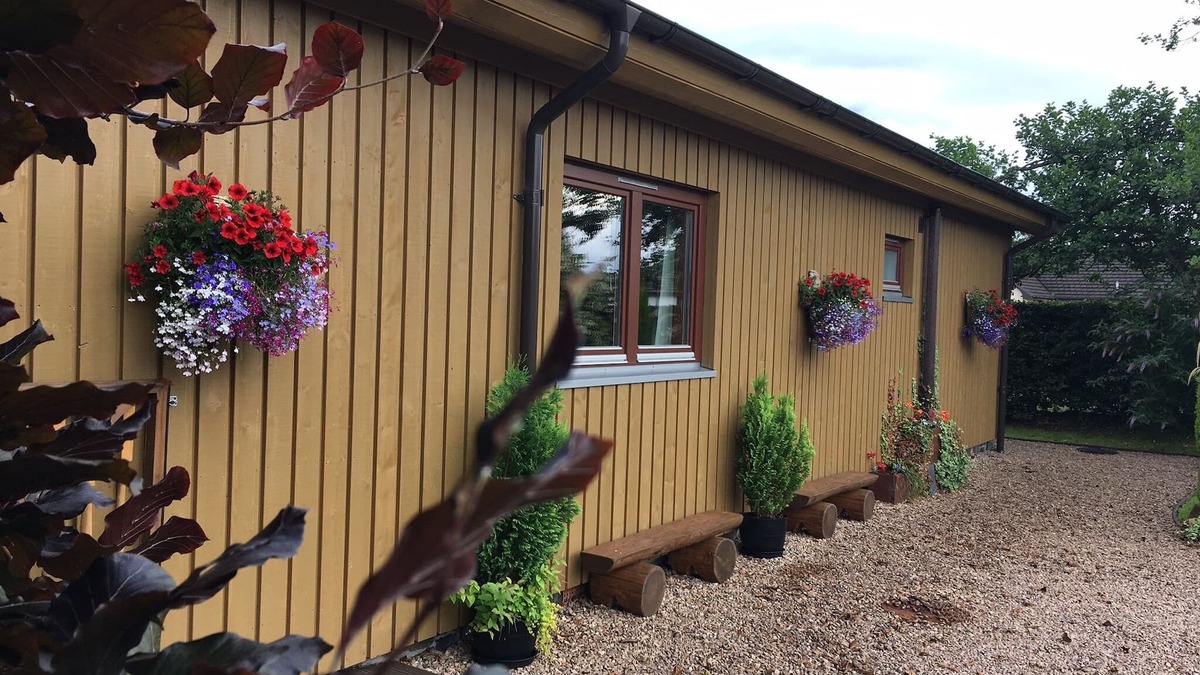 Banavie Ski Chalet | Burnside Lodge, overlooking river Lundy, backdrop of Ben Nevis and Nevis Range.