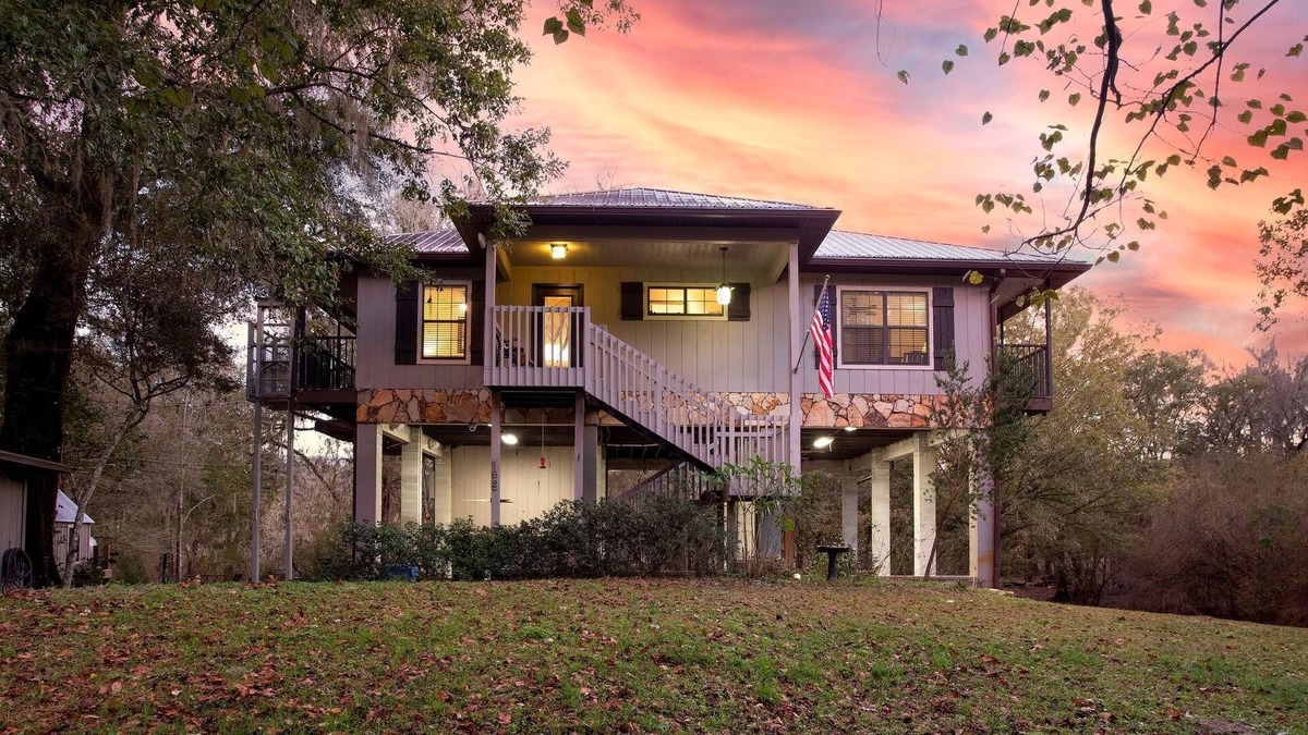 Branford Cabin | Camp Manatee - Riverfront Cabin, Stunning Views, Pet-Friendly, Hot tub + Kayaks!
