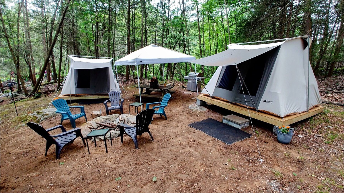 Dover Plains RV Rental | Campers Paradise, cozy tents, hot tub, free EV charger. Pet friendly