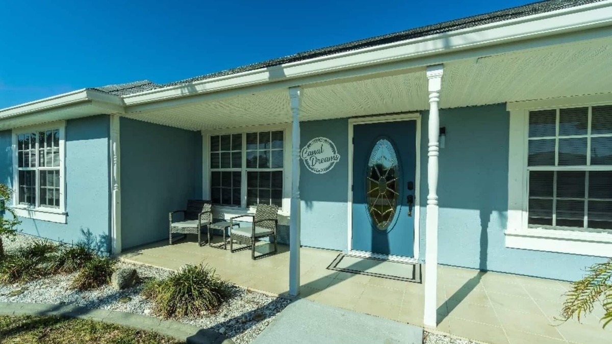South Gulf Cove House | Canal Dreams a Gorgeous 3 BR/2 BA home with heated pool on the canal