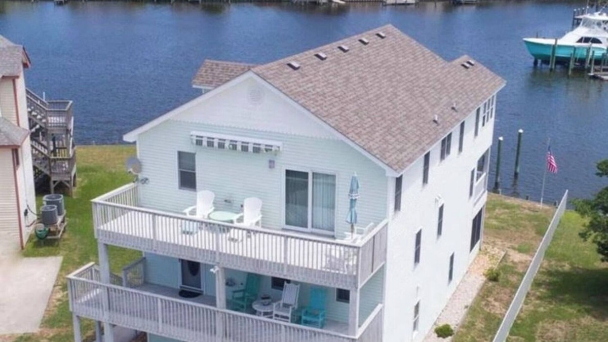 Colington Harbour House | Canal Front Home with Private Dock, Multiple Decks & Hot Tub