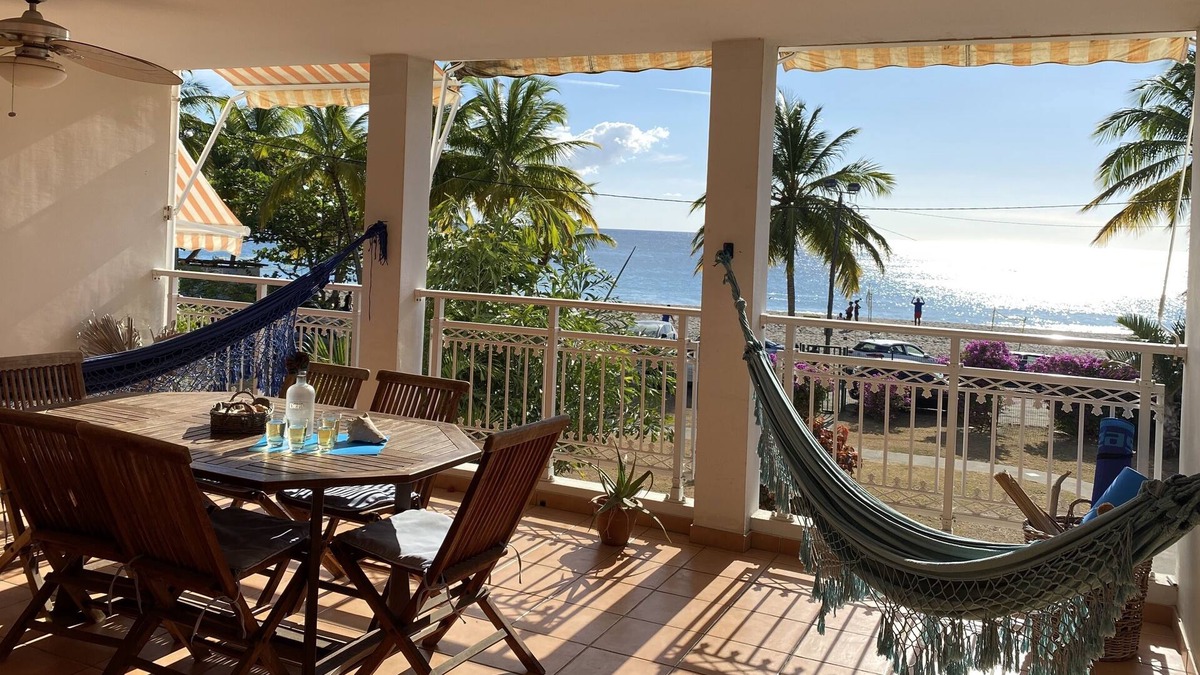 Le Carbet Apartment | Carbet Apartment on the beach side of standing with your feet in the water