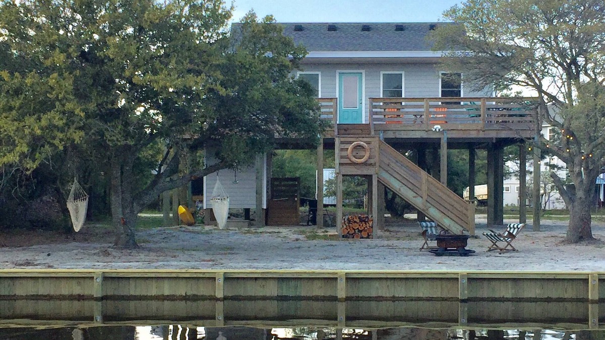 Carova Beach Cottage | Carova Beach Canal Front Cottage 4x4 required Beach Parking Pass provided