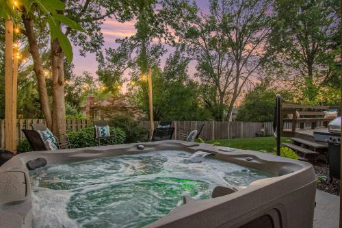 West Omaha House | Central Family Oasis with Hot Tub & Fenced Yard