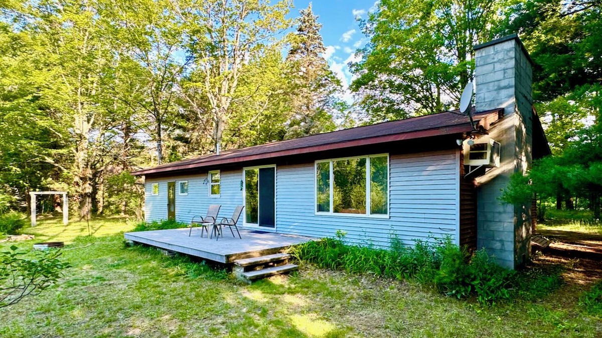 Thompsonville House | Charming 2-bedroom house with intimate Betsie River setting, AC, and WiFi
