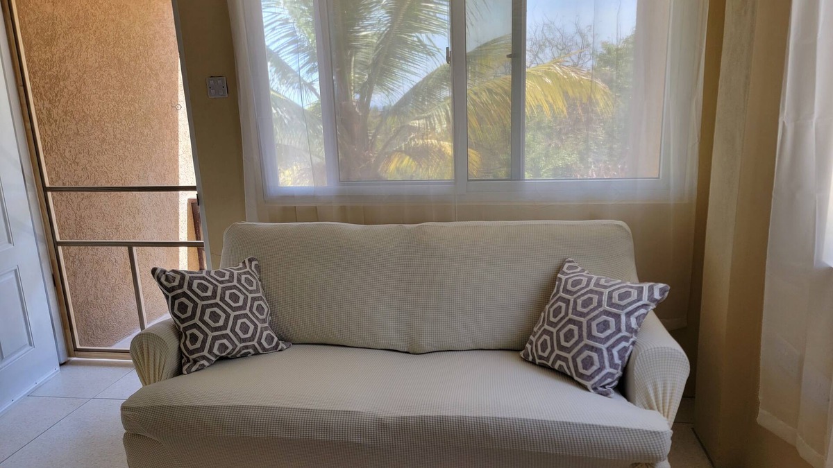Crochu Apartment | Charming 2-bedroom hideaway near Cabier, full kitchen and air-conditioned rooms.