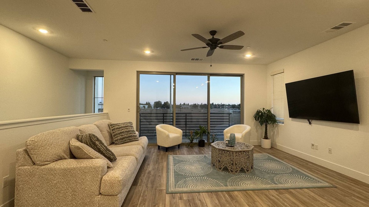 Clovis House | Charming 2-bedroom townhome with garage, pool access, & all utilities included.