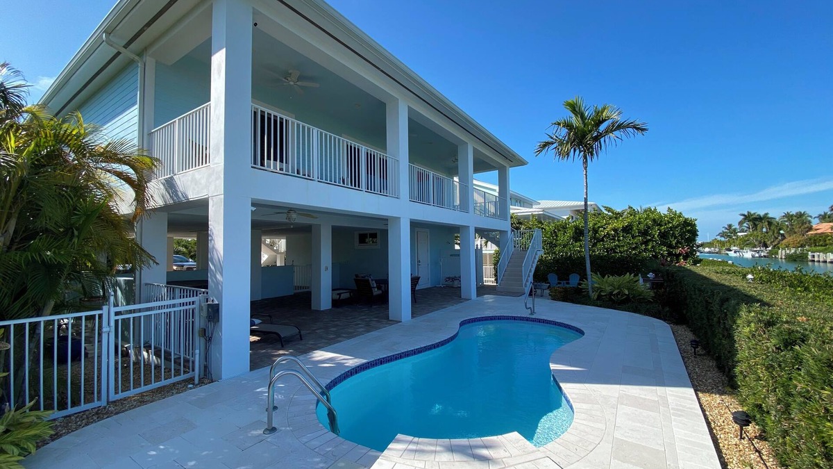 Coury House | Charming 3-bedroom house with pool and boat dock in Key Colony Beach