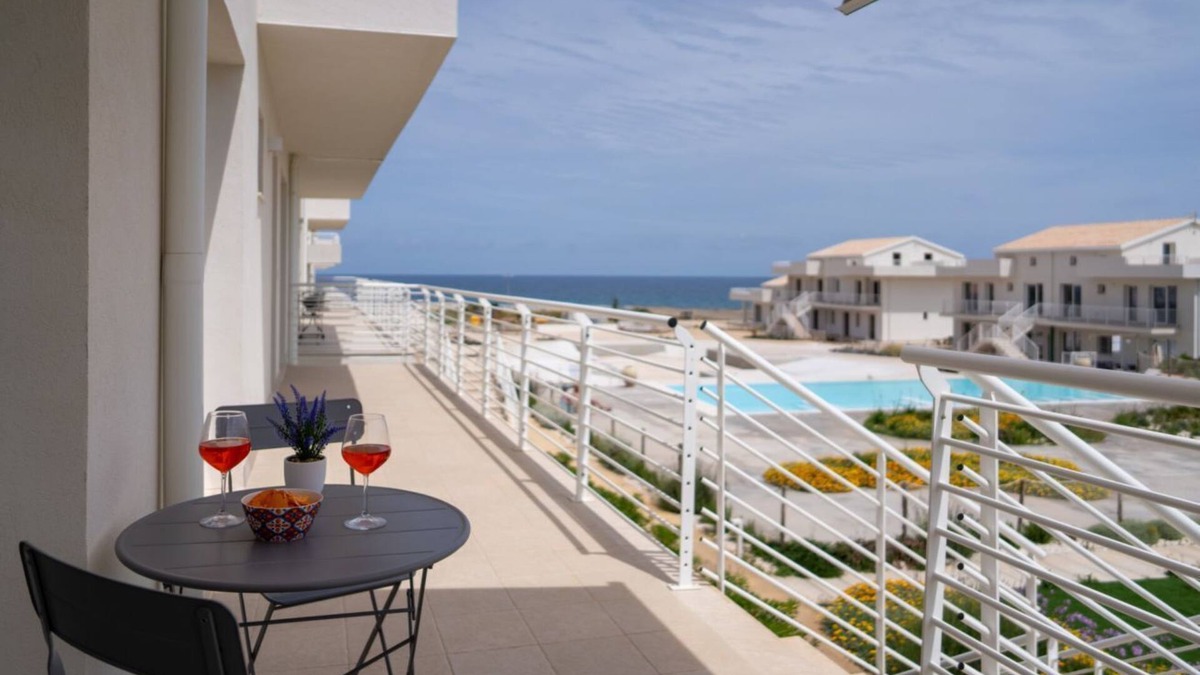 Pachino Apartment | Charming 40 sqm apartment with sea view, accommodating up to 4 guests, located within the renowned Borgo 84 residence, which features a swimming pool and a cycling path. The property is just 3 km from the center of Marzamemi, one of the most picturesque