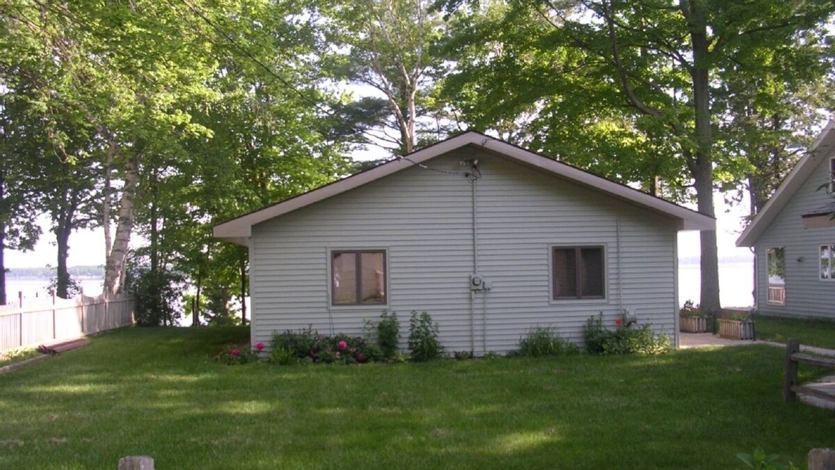 Lake City Cottage | Charming Cottage on Sandy Beach with Beautiful Lake Views from Large Deck