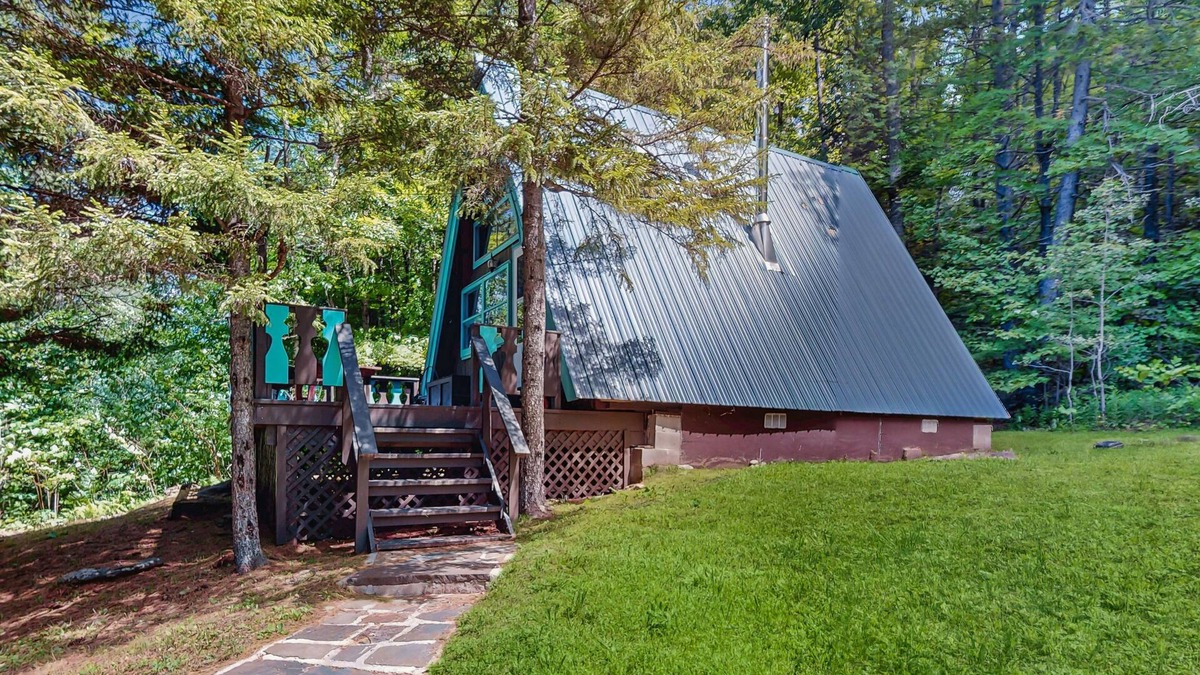 West Townshend House | Charming gingerbread A-frame situated on 3 acres, woodstove, A/C, deck