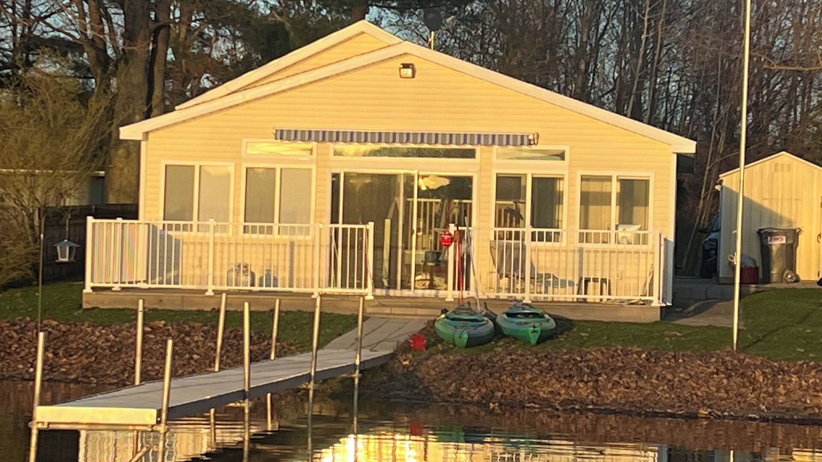 Grant Cottage | Charming lakeside cottage on all-sports lake with private beach & dock