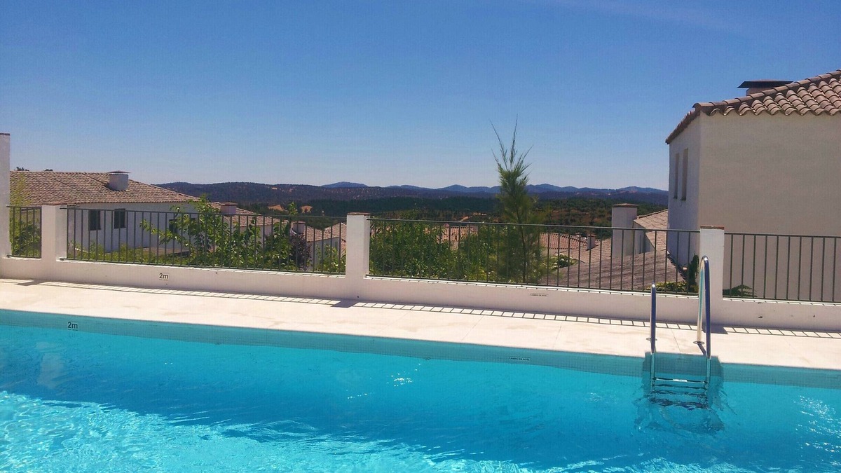 Higuera de la Sierra Villa | charming rustic house in development with pool. Perfect for family