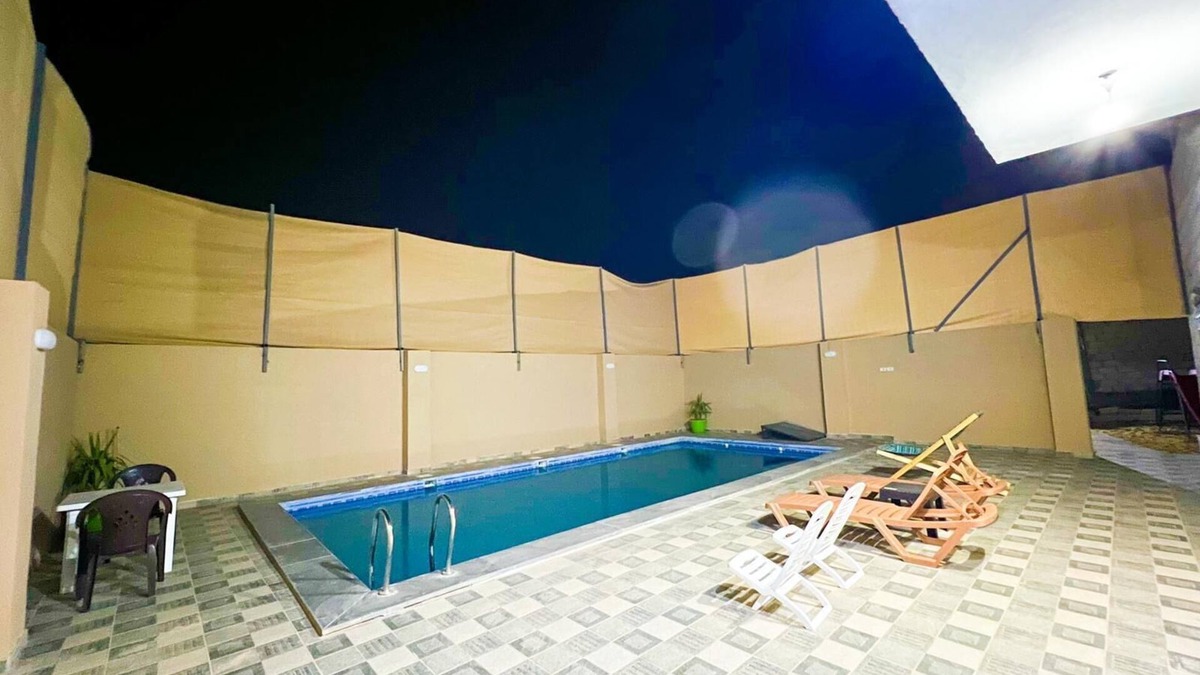 Madaba Villa | Cheerful two bedrooms villa with warm pool, playground,& specious sitting room.