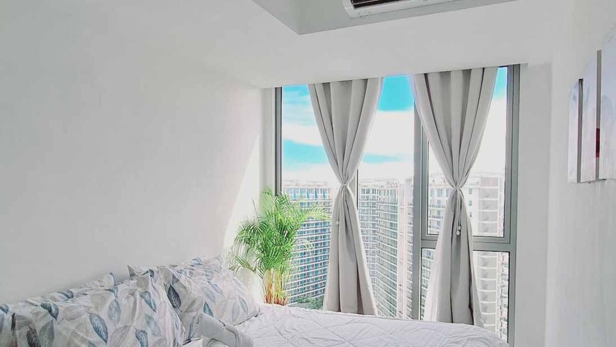 Taguig Condo | Chic 2-bedroom condo with AC, WiFi in enchanting Parañaque