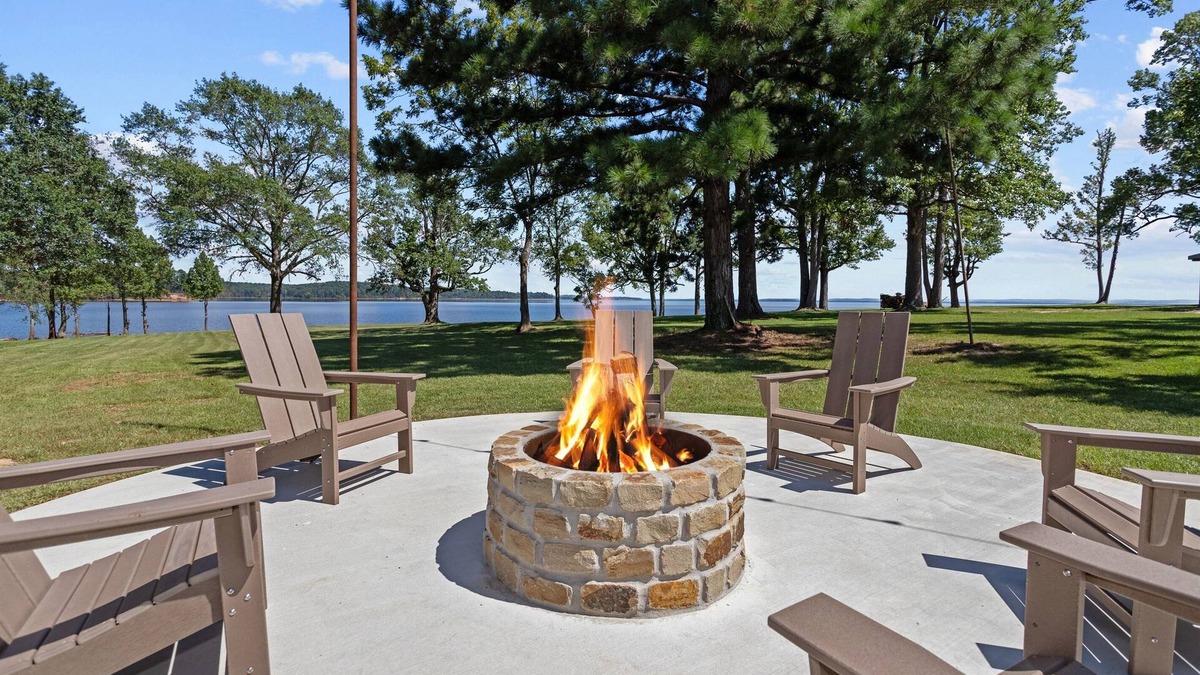 Broaddus House | Chic Lakefront Home | Majestic Views | Cowboy Pool | Outdoor Cinema | Water Toys