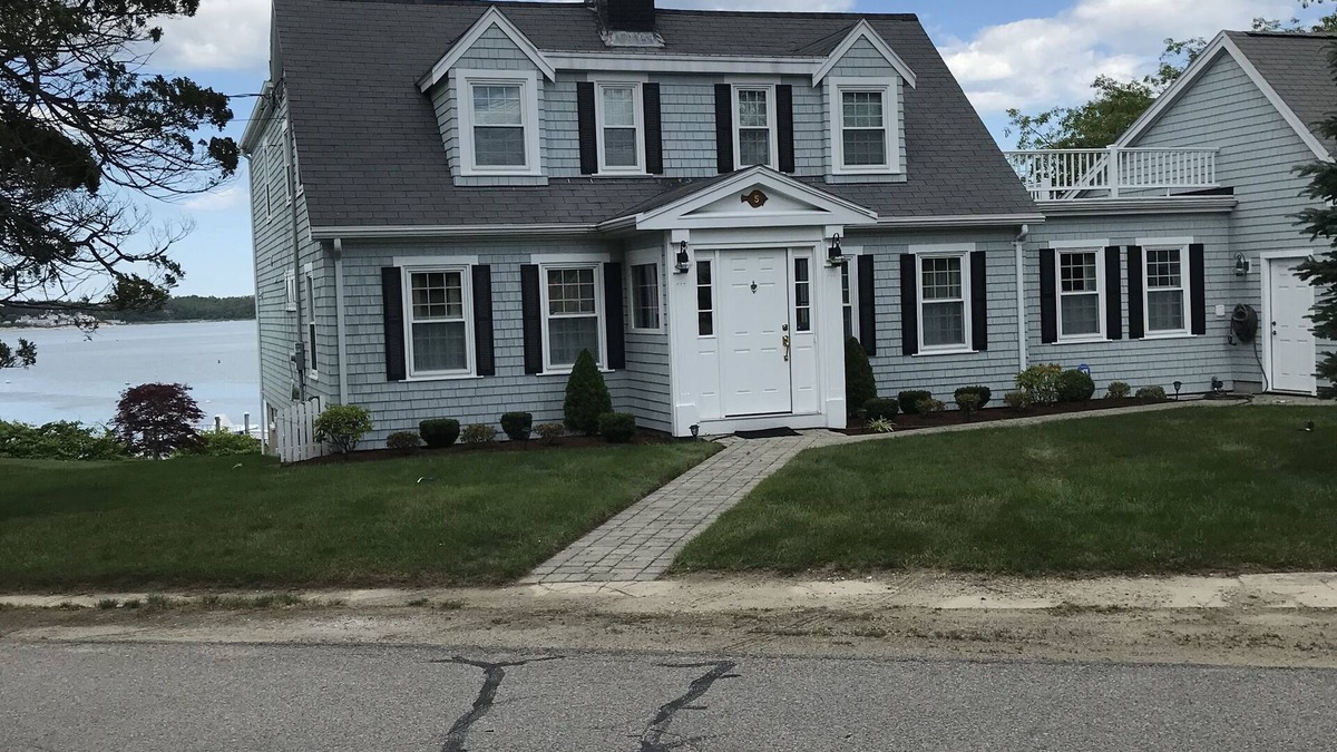 Buzzards Bay House | Classic cape on a hill over looking buttermilk bay