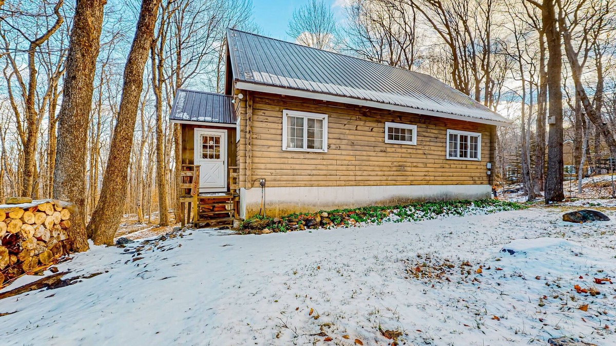Wilmington Cabin | Classic Vermont cabin with forest views, woodstove, pools, hot tub & gym