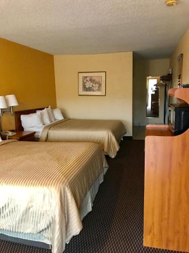 Magnolia Hotel | Coachman's Inn