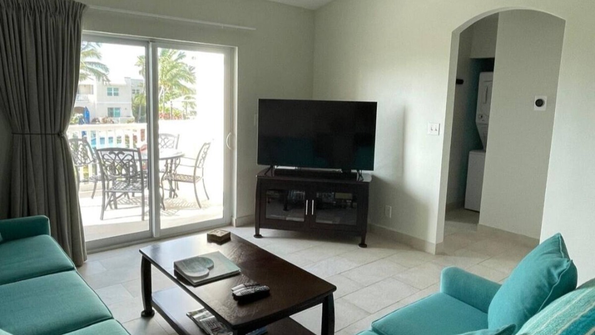 Wheeland Settlement Condo | “Coastal Bliss: Stunning 2-Bedroom Condo with breathtaking Beach and Pool Views”