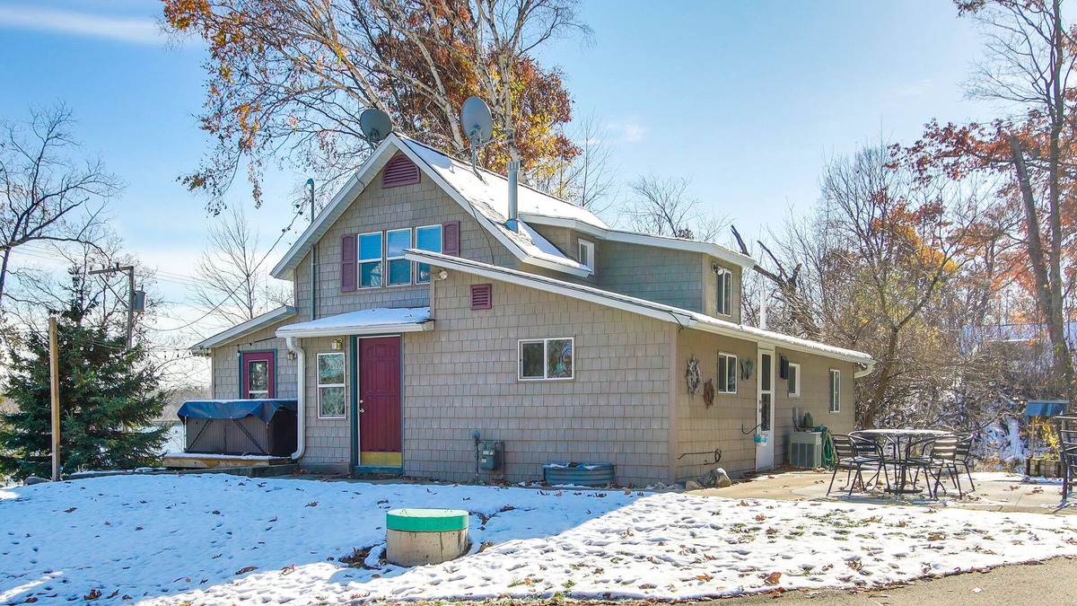 Campbellsport Cottage | Colorful Cottage w/Hot Tub - Steps to Long Lake!